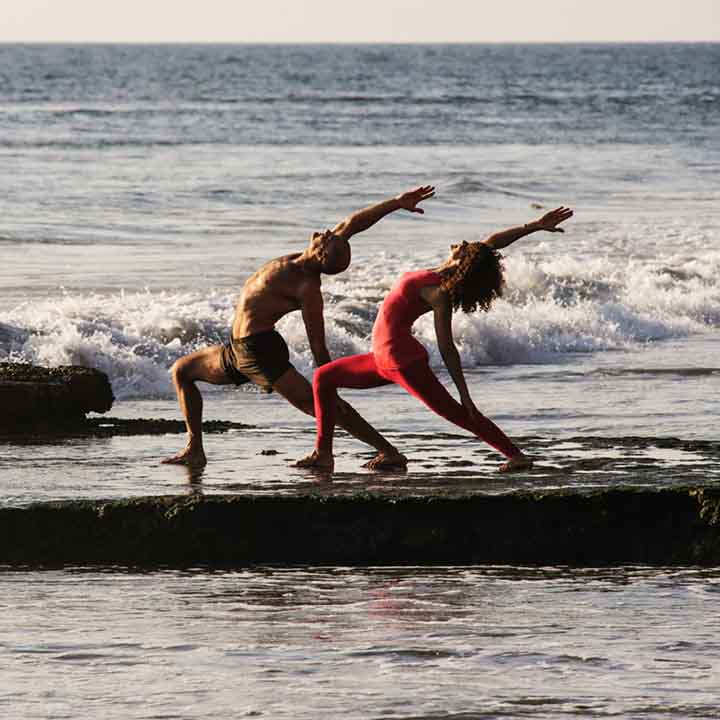 desiree and andrew at waters edge doing yoga