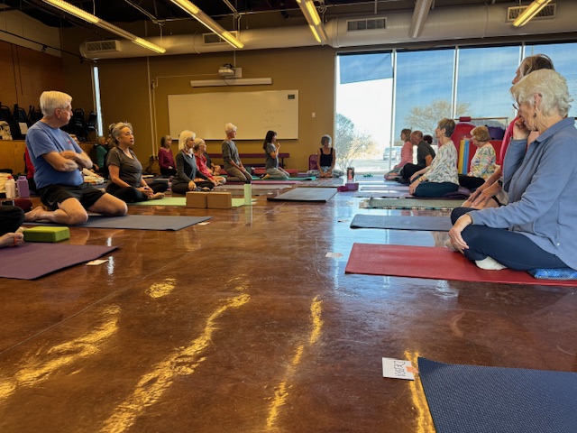 Green Valley yoga workshop attendees seated on mats
